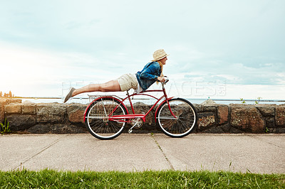 Buy stock photo Holiday, outdoor or woman with bicycle stunt, balance development or active hobby for weekend break. Space, fun activity or person with trick execution on sidewalk, skill practice or summer vacation