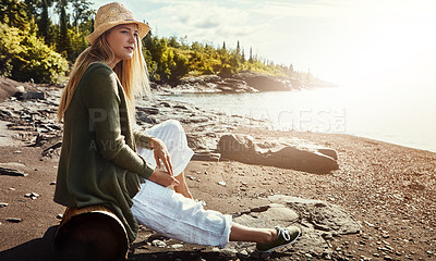 Buy stock photo Thinking, relax and woman on beach with hat, outdoor holiday and calm nature on tropical island. Travel, peace and girl on ocean vacation with water, sand sky and morning inspiration in New Zealand