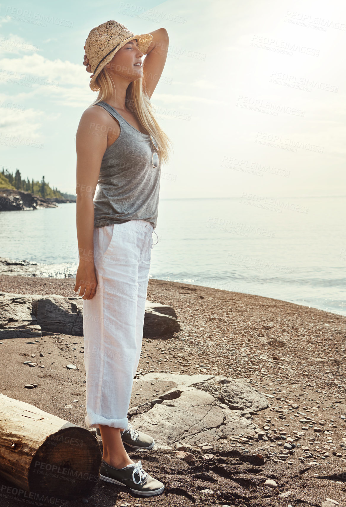Buy stock photo Outdoor, relax and woman on beach for freedom, vacation and holiday weekend in California with smile. Ocean, girl and carefree for travel adventure, peaceful and enjoy sunshine with calm in sea