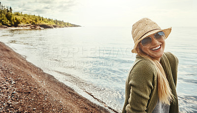 Buy stock photo Happy woman, portrait and laughing with glasses at beach for holiday, weekend or outdoor getaway. Young female person with smile in fashion for fun journey, trip or happiness by ocean coast in nature