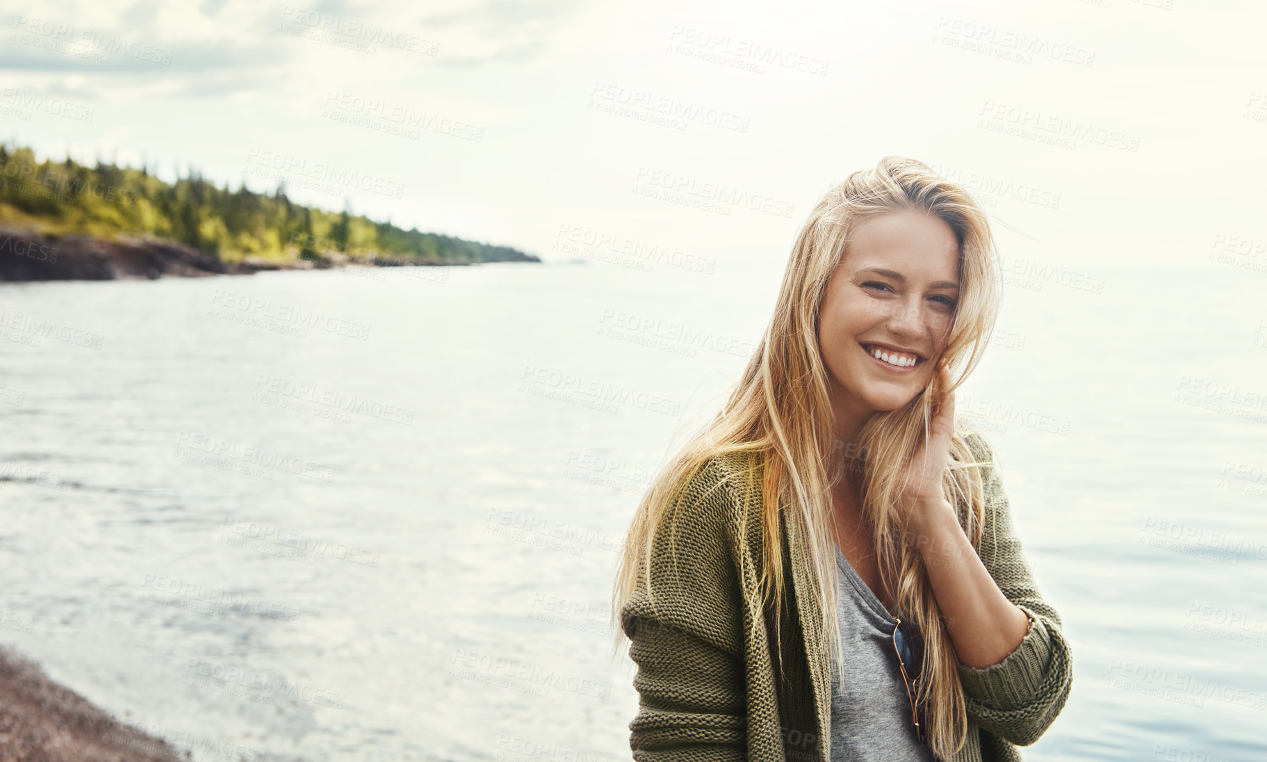 Buy stock photo Holiday, portrait and happy woman at beach on vacation, travel or relax outdoor on island in Switzerland. Ocean, smile or face of girl at sea water for journey, adventure or tourist on trip in nature