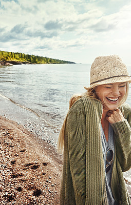 Buy stock photo Laughing, woman and holiday at beach, travel and happy on adventure, tourism or fresh air on getaway. Outdoor, traveler and person with smile in nature, thinking and break on vacation, sea and space