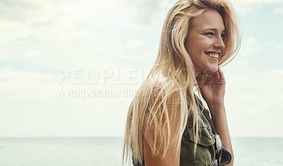 Buy stock photo Shot of an attractive young woman spending a day at the lake