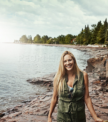 Buy stock photo Portrait of an attractive young woman spending a day at the lake