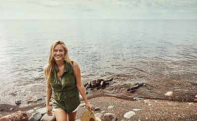 Buy stock photo Portrait of an attractive young woman spending a day at the lake