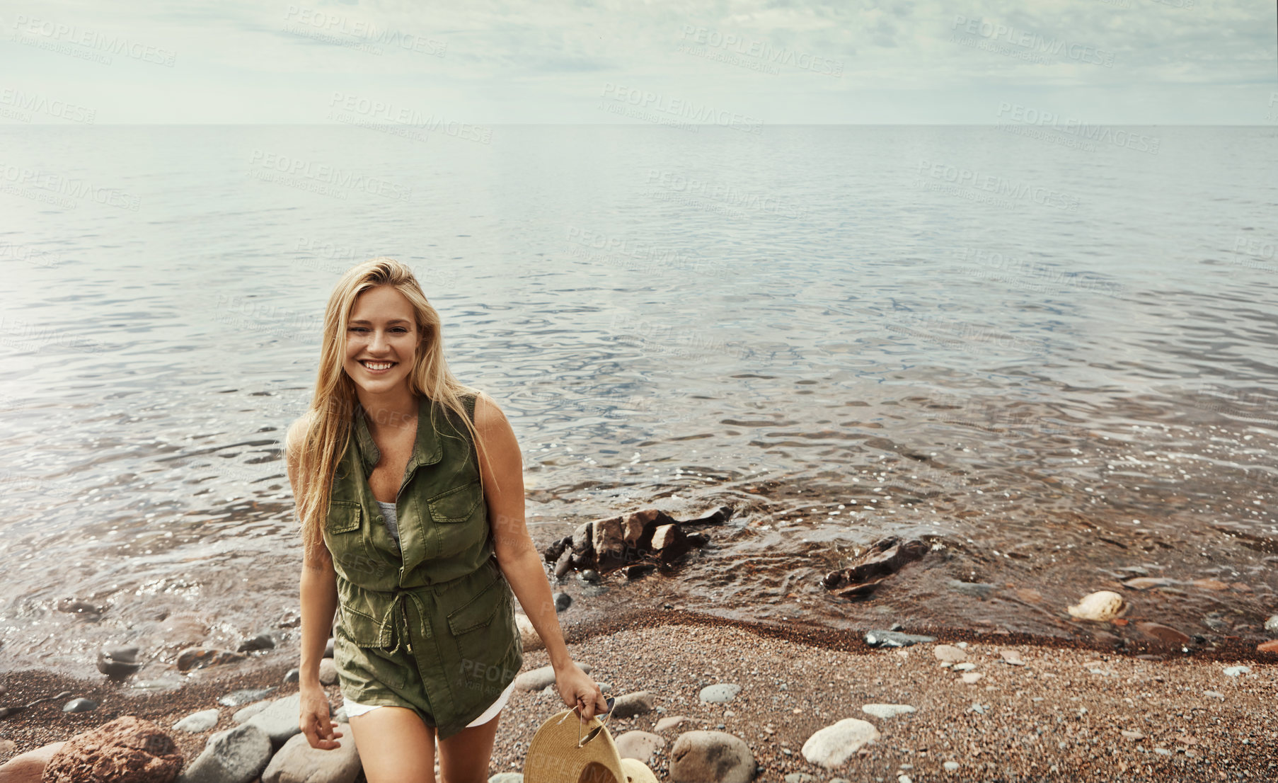 Buy stock photo Portrait of an attractive young woman spending a day at the lake