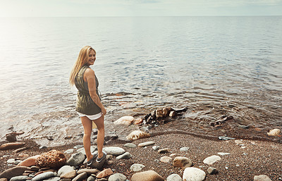 Buy stock photo Portrait of an attractive young woman spending a day at the lake