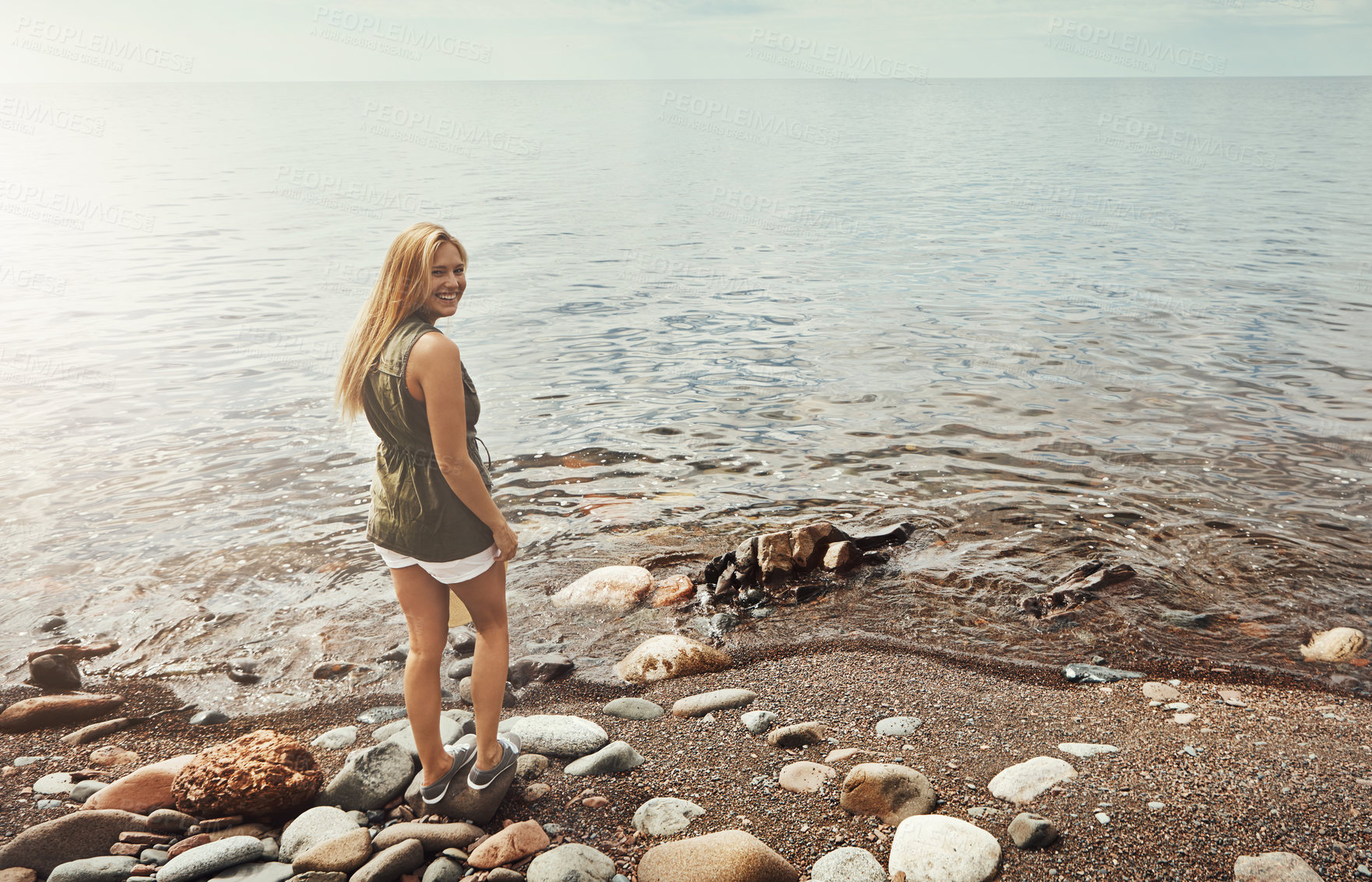 Buy stock photo Portrait of an attractive young woman spending a day at the lake