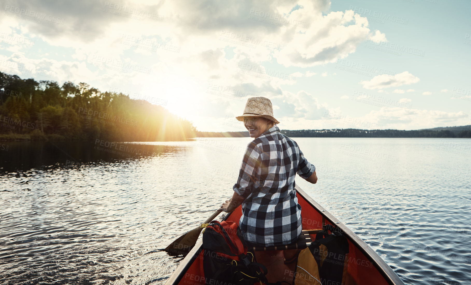 Buy stock photo Portrait of an attractive young woman spending a day kayaking on the lake