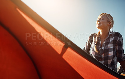 Buy stock photo Shot of an attractive young woman spending a day kayaking on the lake