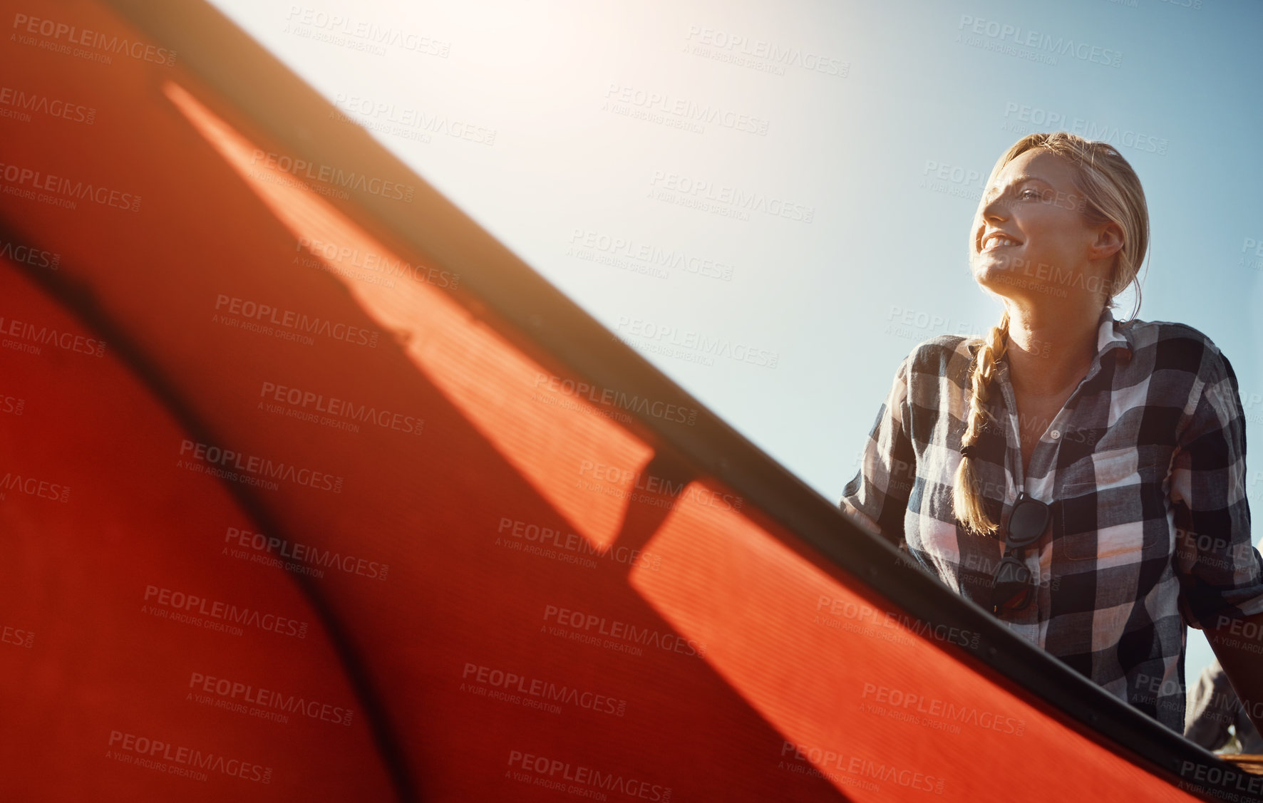 Buy stock photo Shot of an attractive young woman spending a day kayaking on the lake