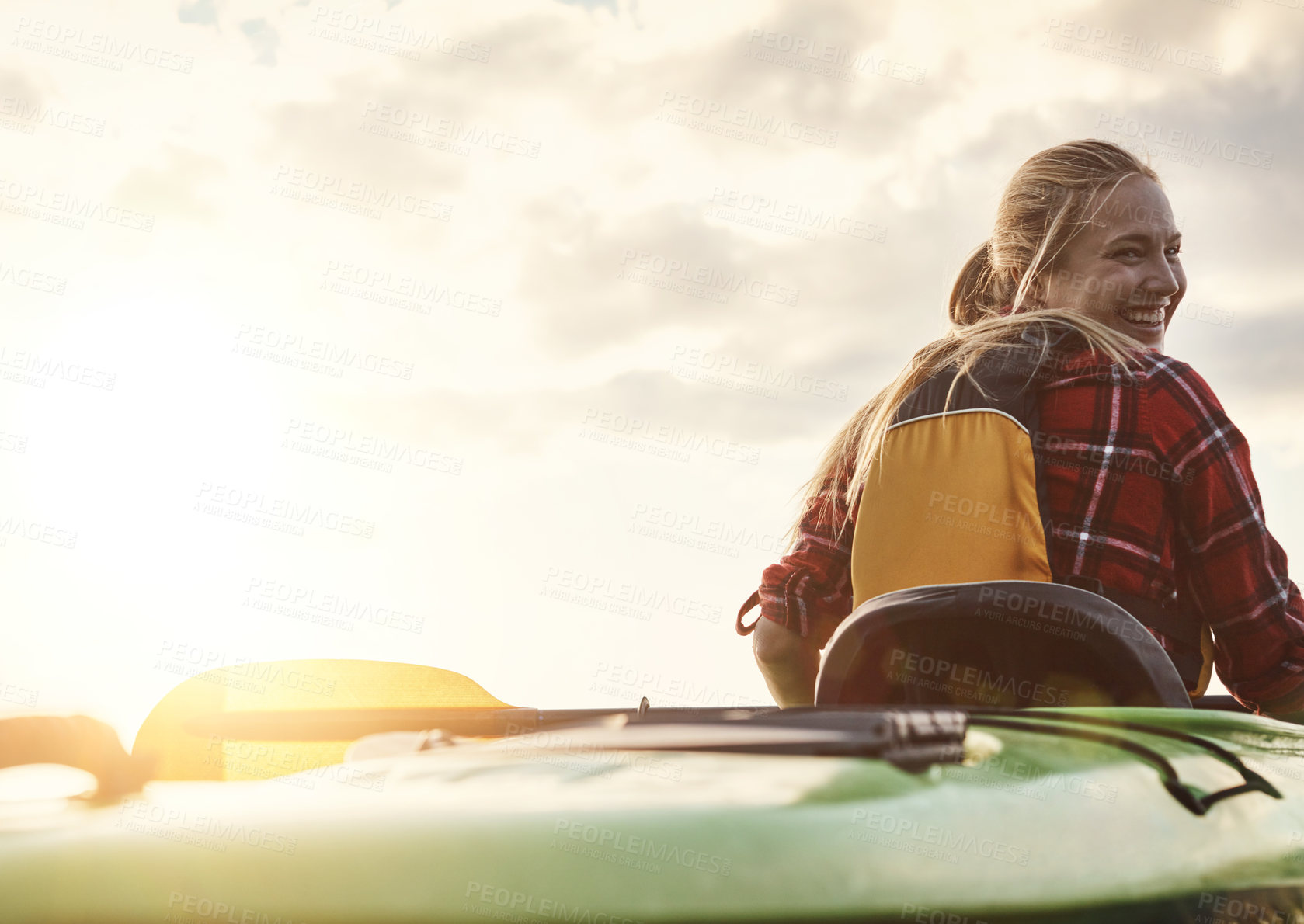 Buy stock photo Shot of an attractive young woman out for canoe ride on the lake