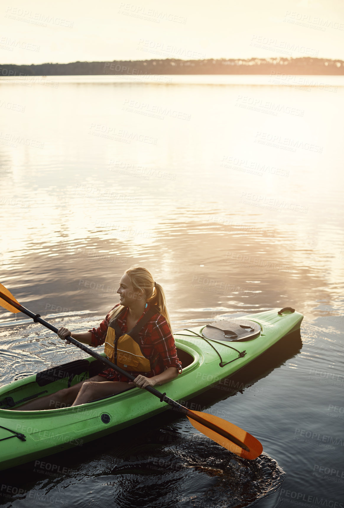 Buy stock photo Shot of an attractive young woman out for canoe ride on the lake