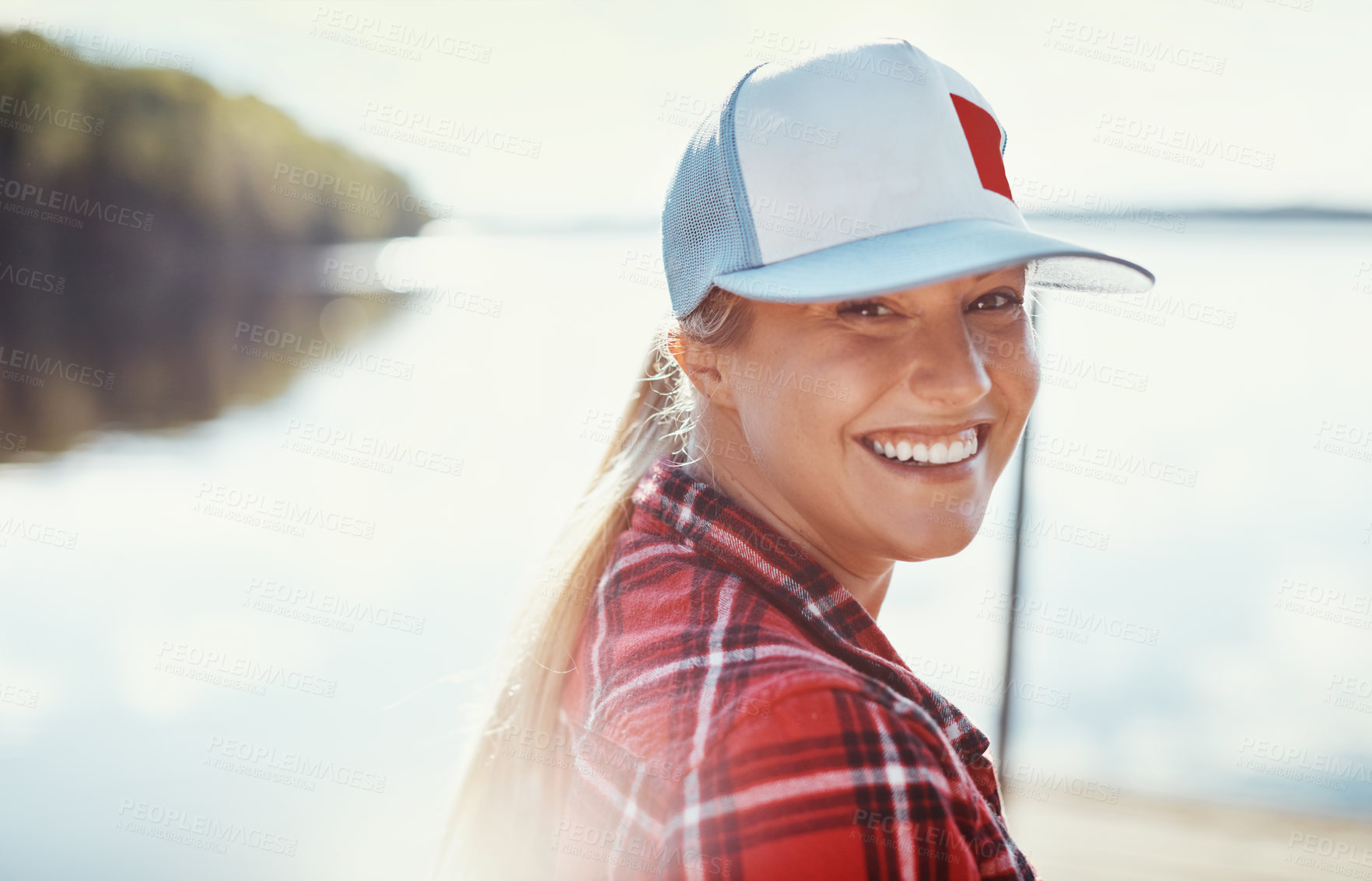 Buy stock photo Shot of a young woman relaxing alone in nature