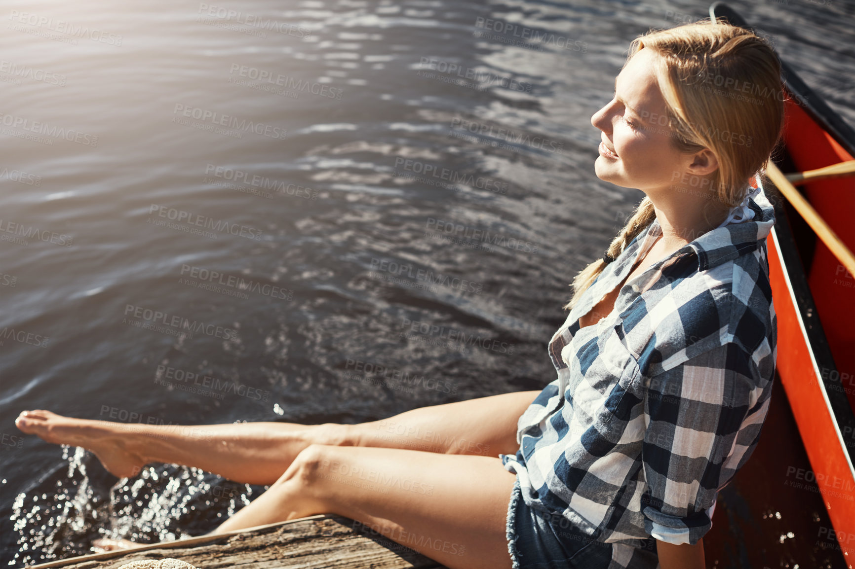 Buy stock photo Woman, lake and travel with foot in water, relax on vacation with freedom in nature for wellness. Female person, happiness and holiday by river with feet splash, kayak for adventure tourism in Canada