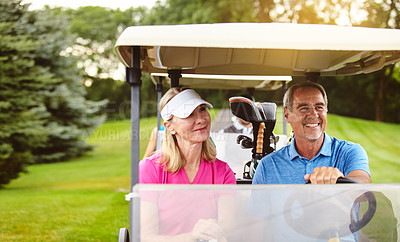 Buy stock photo Shot of an affectionate mature couple spending a day on the golf course