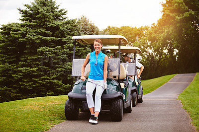 Buy stock photo Full length portrait of an attractive young woman leaning against a golf cart on a golf course