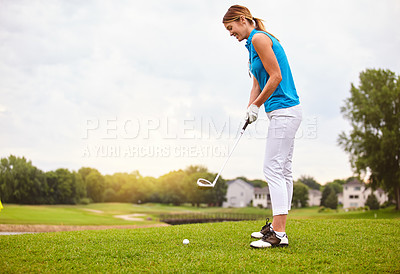 Buy stock photo Full length shot of an attractive young woman playing a round of golf on a golf course