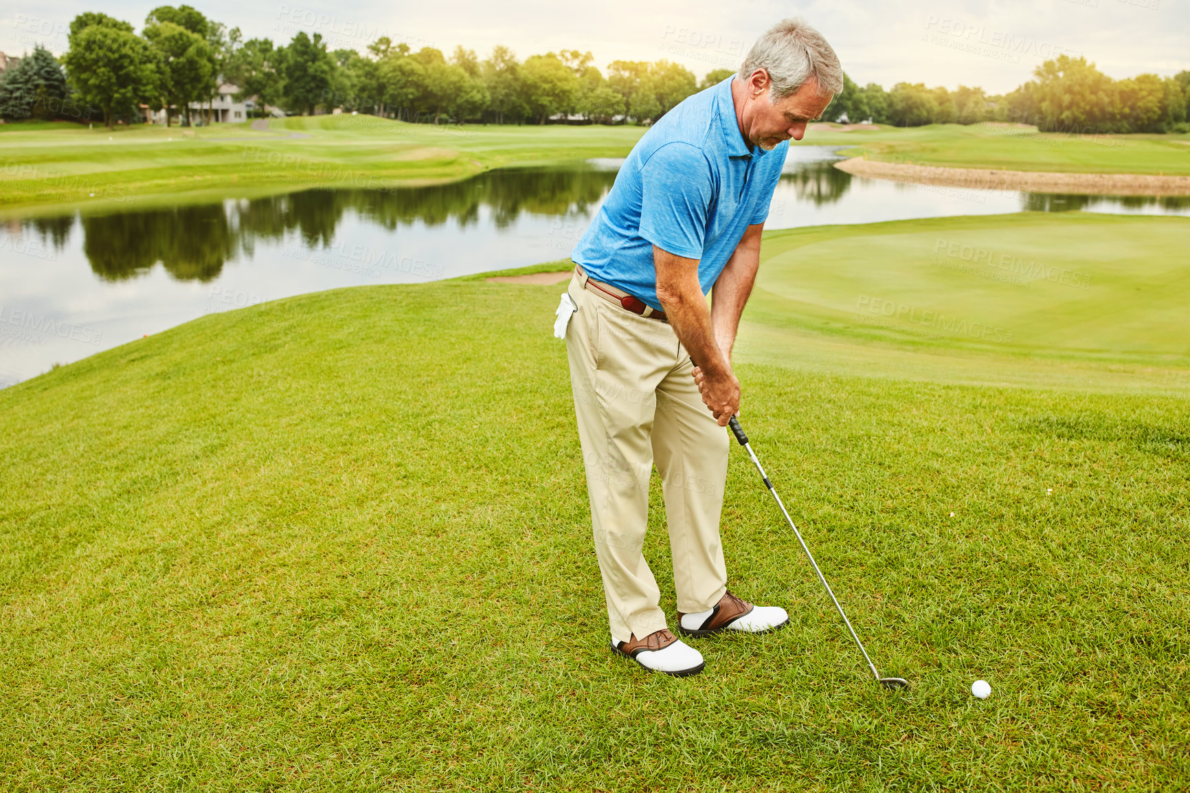 Buy stock photo Mature, man and stroke on golf course or nature with club for mental target, skill and precision or training for tournament. Male golfer, lake and thoughts for game plan, shot strategy and exercise.