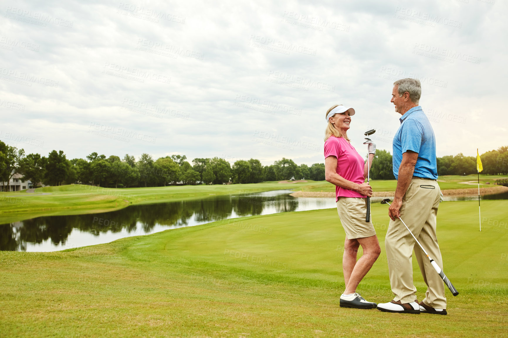 Buy stock photo Shot of a mature couple out playing golf together