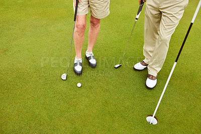 Buy stock photo Cropped shot of two unrcognizable people playing golf together