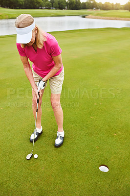 Buy stock photo Full length shot of a mature woman out playing golf on a golf course