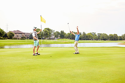 Buy stock photo Men, golf and celebrate on green for tee off in morning as members in club for health, wellness or business. Male people, putter and hole for sports, exercise or success as partner in company for win