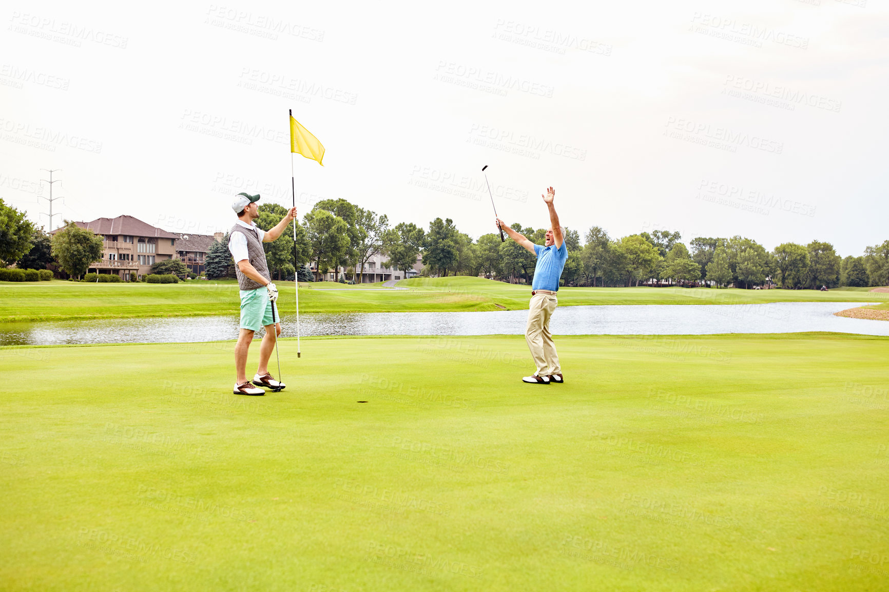 Buy stock photo Men, golf and celebrate on green for tee off in morning as members in club for health, wellness or business. Male people, putter and hole for sports, exercise or success as partner in company for win