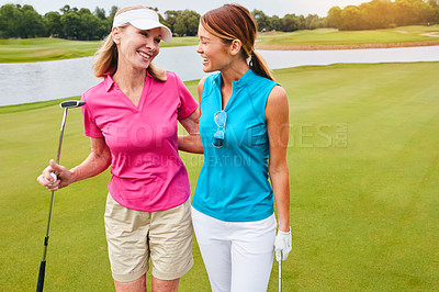 Buy stock photo Shot of two women out playing golf together