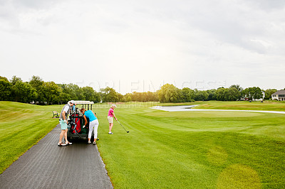 Buy stock photo Shot of four people out on a double date on a golf course