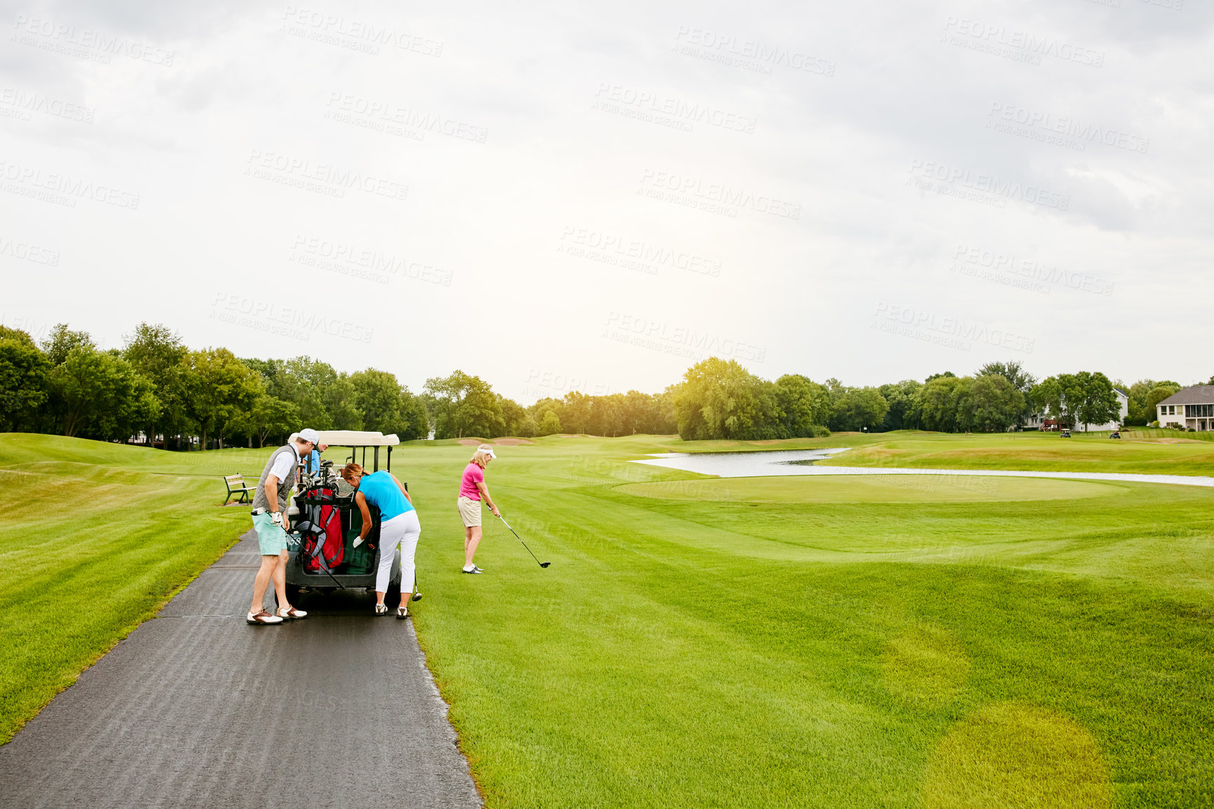 Buy stock photo Shot of four people out on a double date on a golf course