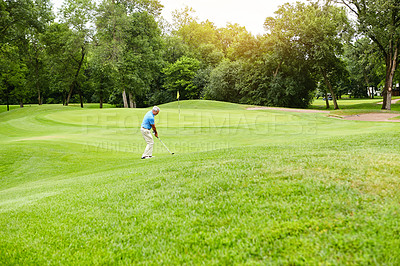 Buy stock photo Shot of a mature man on a golf course
