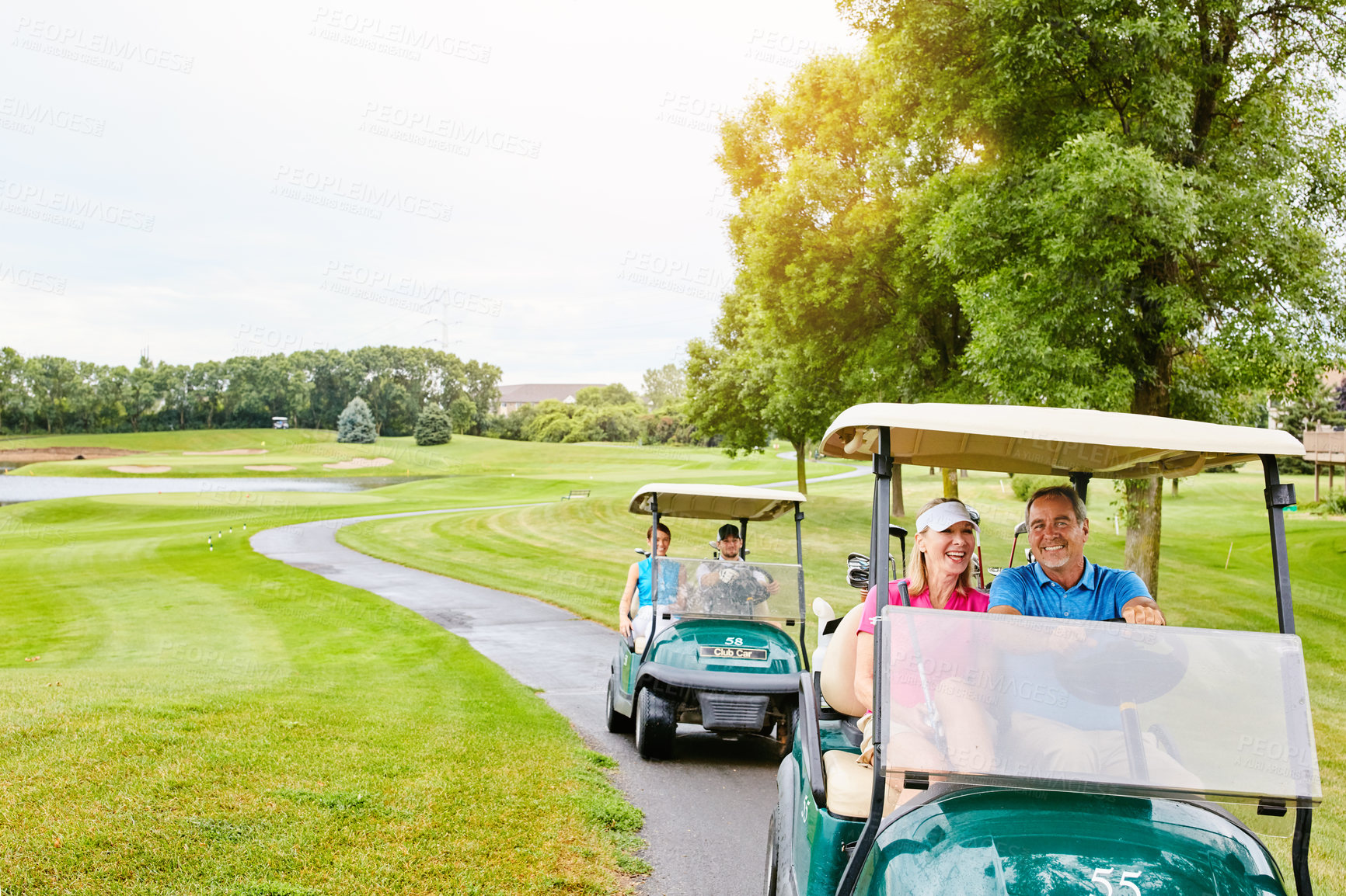 Buy stock photo People, golf cart and nature field or driving, happy and relax in transport for country club hobby on weekend break. Fitness, couple and smile on sport course for game, golfers and together on path
