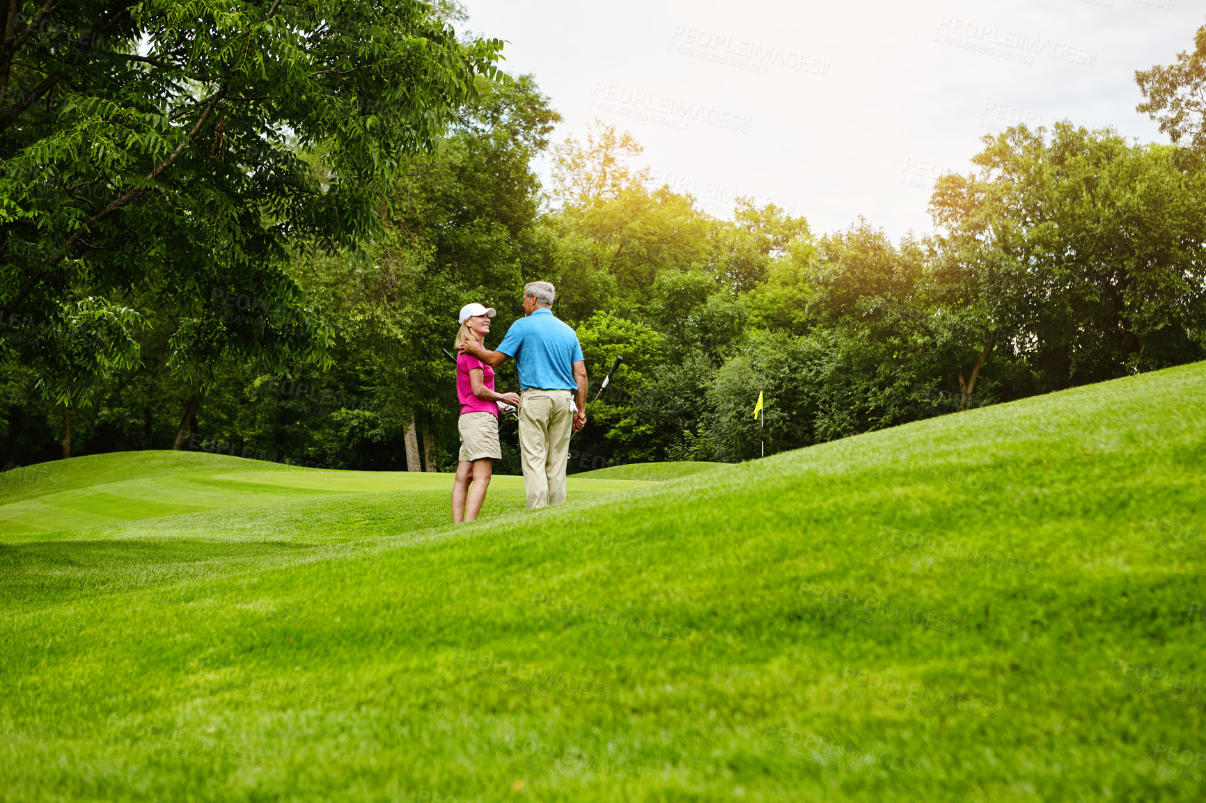 Buy stock photo Back, mature couple and conversation at golf course with sports, hobby and activity for retirement. People, break and happy at club for fitness, training and exercise for health with fun and bonding