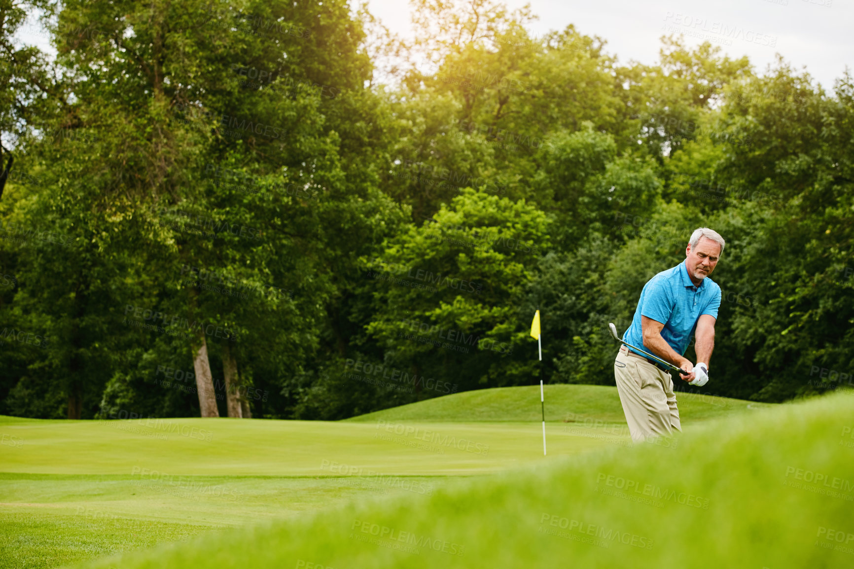 Buy stock photo Senior man, golf stroke and active for wellness, retirement and playing with grass field, practice and hobby. Pensioner, game and mature guy with club, training or sports with break, motion or skills