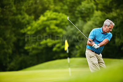 Buy stock photo Shot of a mature man on a golf course