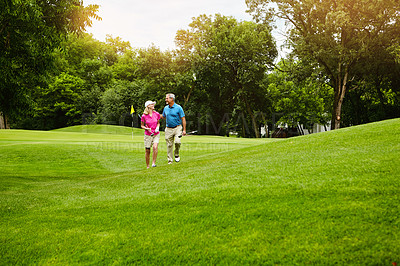 Buy stock photo Shot of a mature couple on a golf course