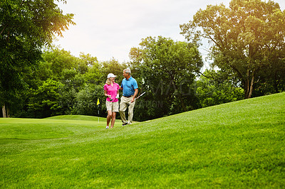 Buy stock photo Shot of a mature couple on a golf course