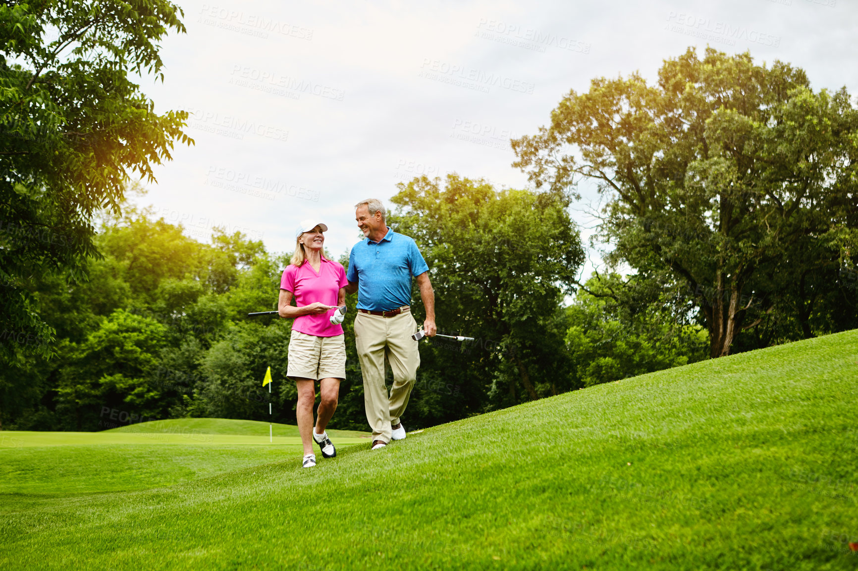 Buy stock photo Shot of a mature couple on a golf course