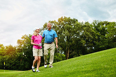 Buy stock photo Shot of a mature couple on a golf course