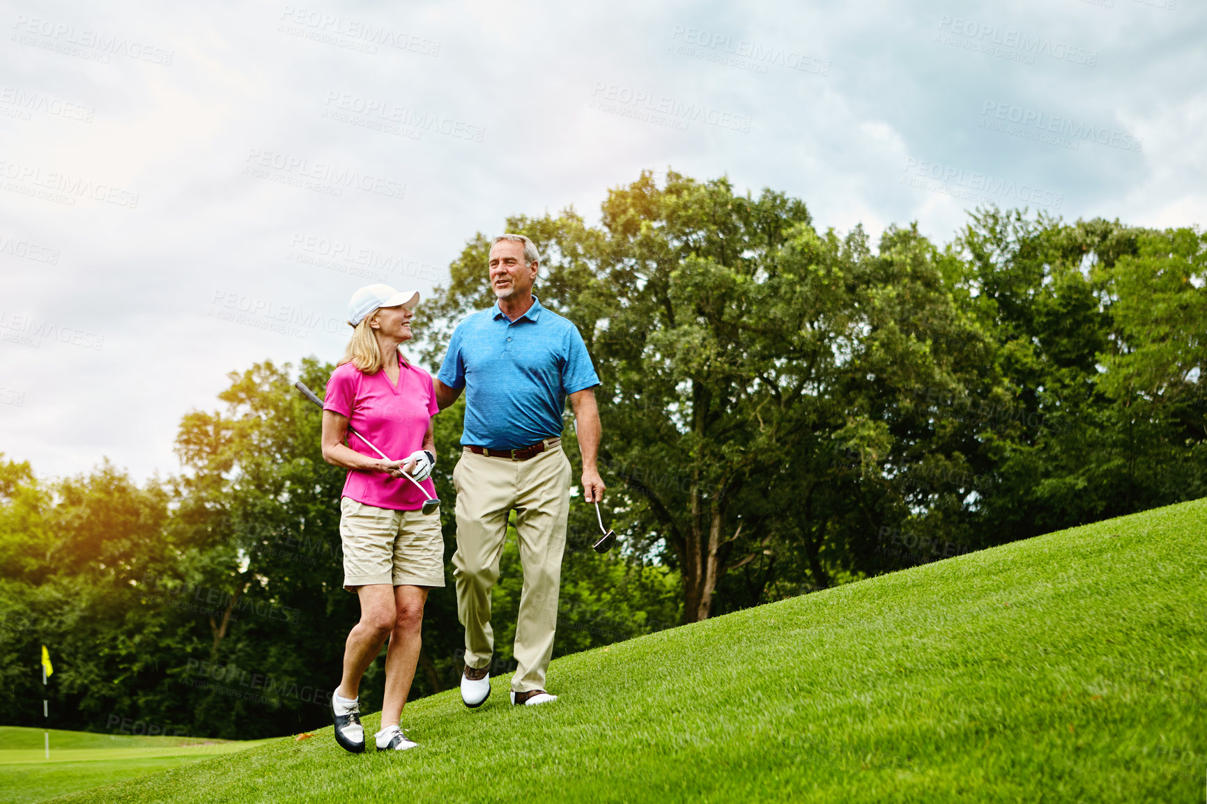 Buy stock photo Shot of a mature couple on a golf course