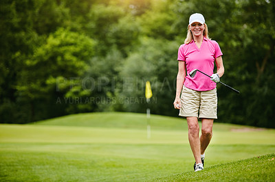 Buy stock photo Shot of a mature woman on a golf course