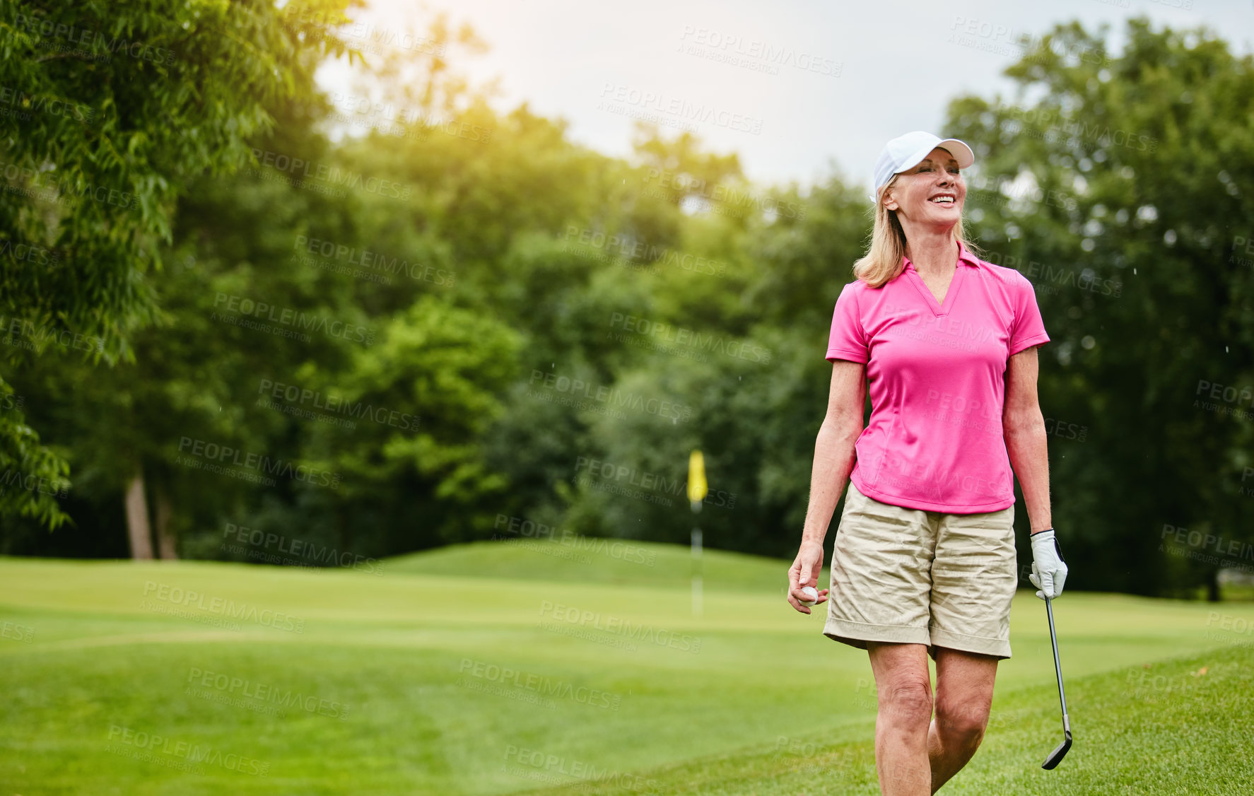 Buy stock photo Shot of a mature woman on a golf course