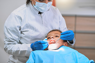 Buy stock photo Checkup, dentist and examination with child in hospital for procedure or consultation in oral care clinic. People, patient and protective mask as hygienist for teeth cleaning or root canal treatment