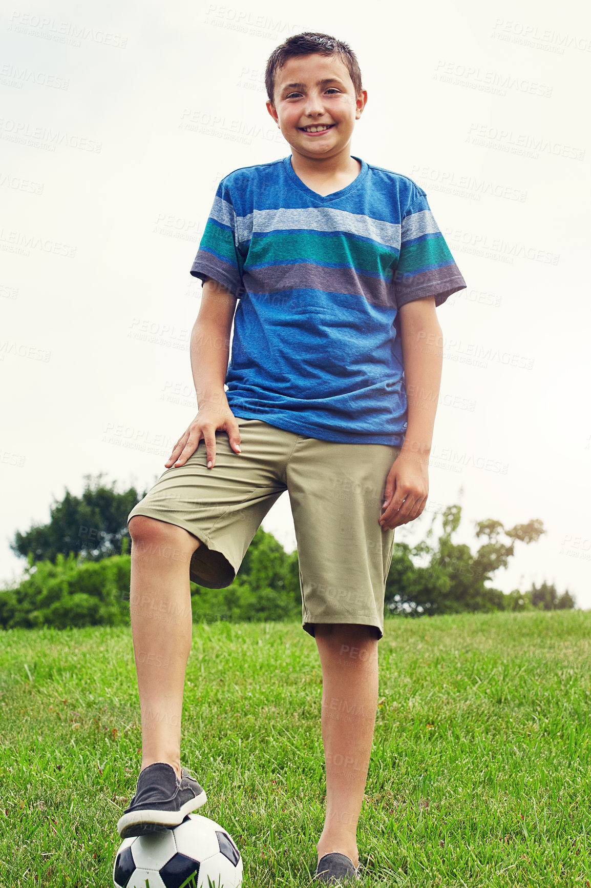 Buy stock photo Nature, boy and portrait of child with soccer ball in outdoor park for development, growth or hobby. Grass, sports and young kid with smile for happiness, playing or football game in playground