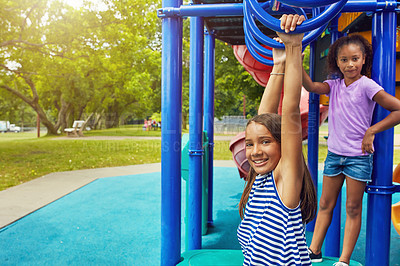 Buy stock photo Shot of a group of young friends hanging out together at a playground