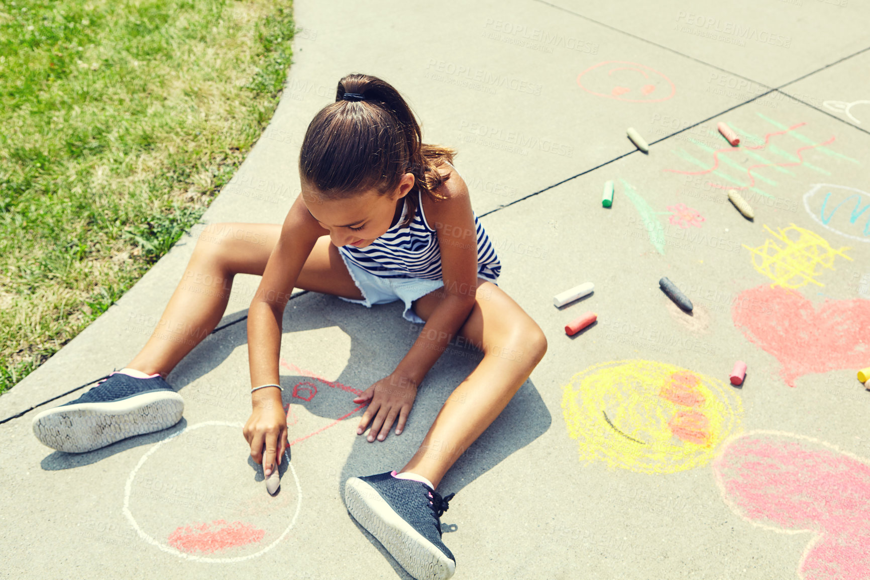 Buy stock photo Girl, child and drawing on ground at school with chalk for learning, development and creativity. Kid, art and happy in sunshine on sidewalk, path and writing with shape, lines and pattern at academy