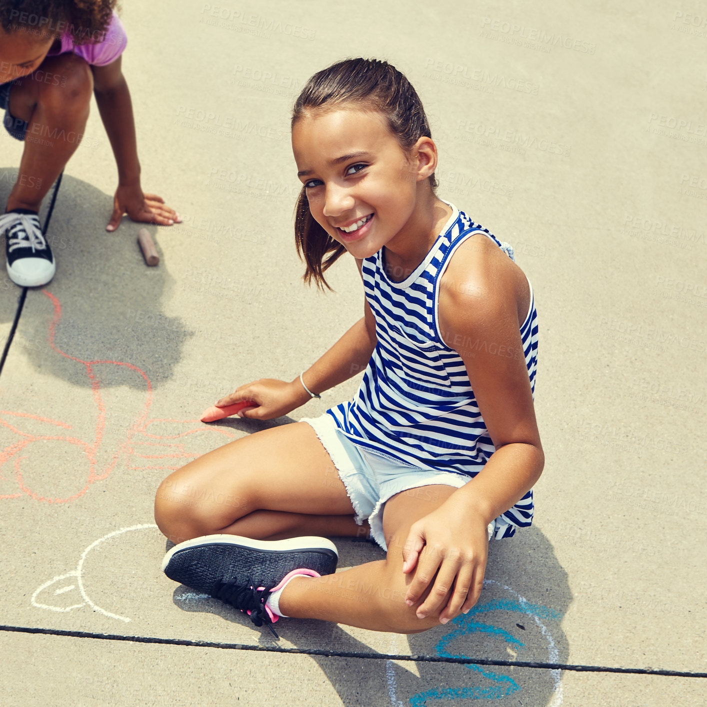 Buy stock photo Girl, children and smile on ground with chalk on concrete for portrait, play and creativity in summer. Kid, drawing and art in sunshine, sidewalk and writing with shape, lines and pattern at academy