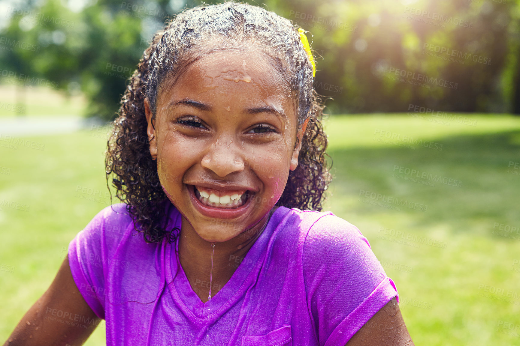 Buy stock photo Portrait of an adorable little girl wet of water balloons outdoors