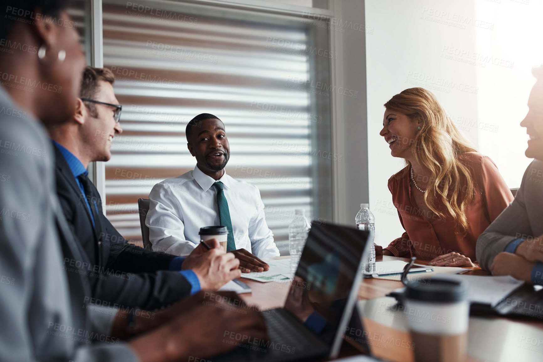 Buy stock photo Shot of a group of businesspeople having a meeting in an office